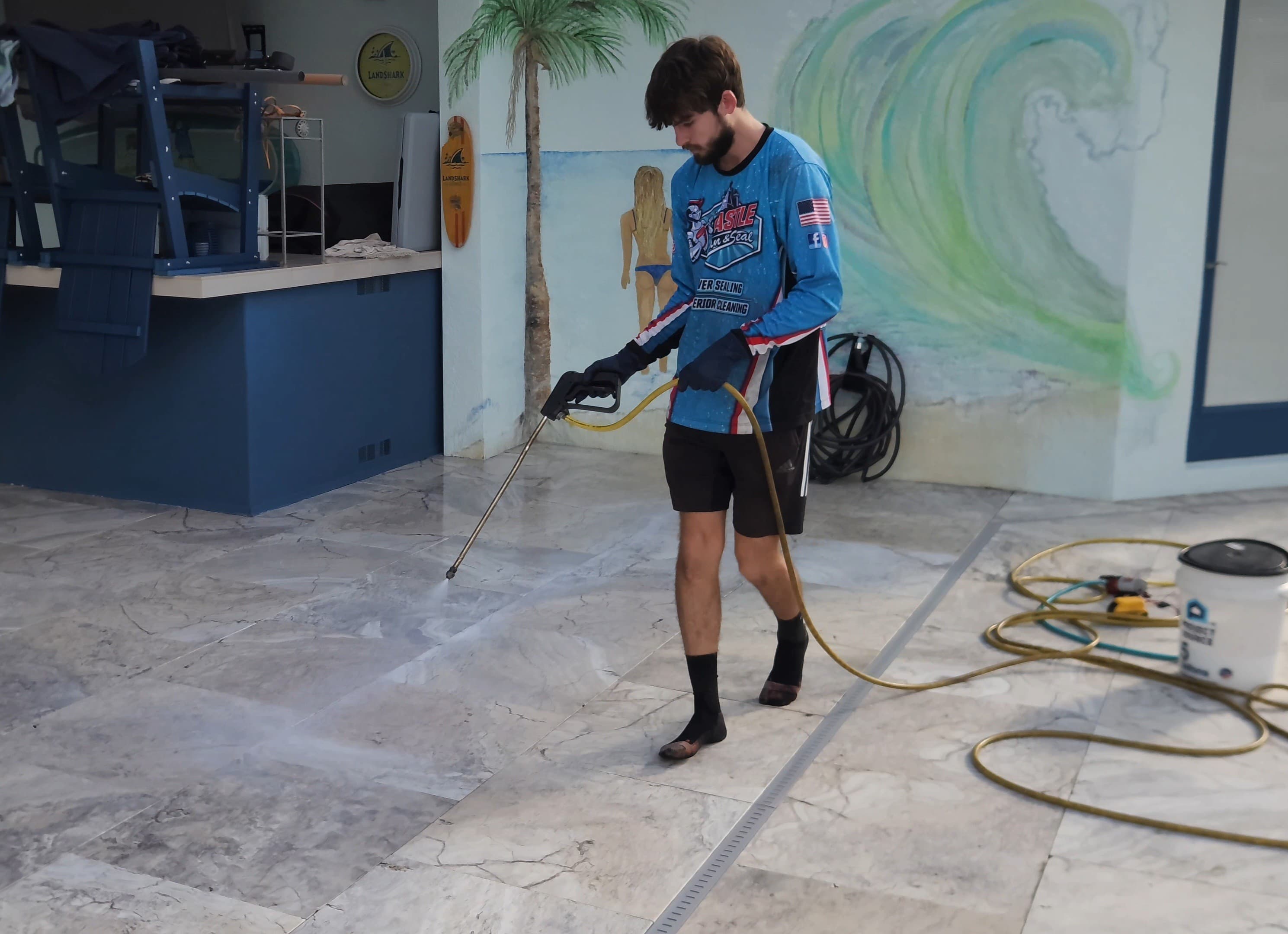 Paver sealing in progress on a residential driveway